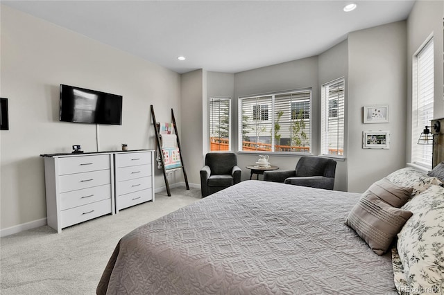 bedroom with light colored carpet, baseboards, and recessed lighting