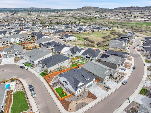 birds eye view of property with a residential view and a mountain view