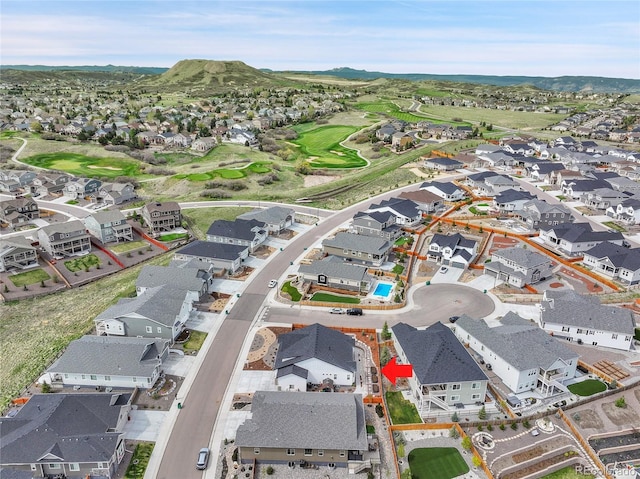 aerial view featuring a mountain view and a residential view