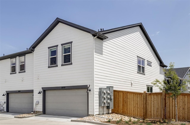 5099 S Robb St, Littleton, CO 80127 - view of side of property with a garage