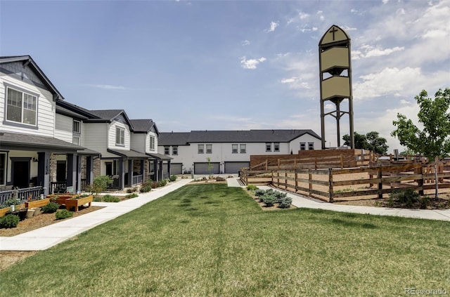5099 S Robb St, Littleton, CO 80127 - view of community featuring a residential view, a lawn, and a vegetable garden