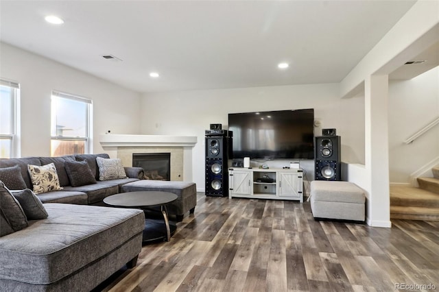 living room with a fireplace and hardwood / wood-style flooring