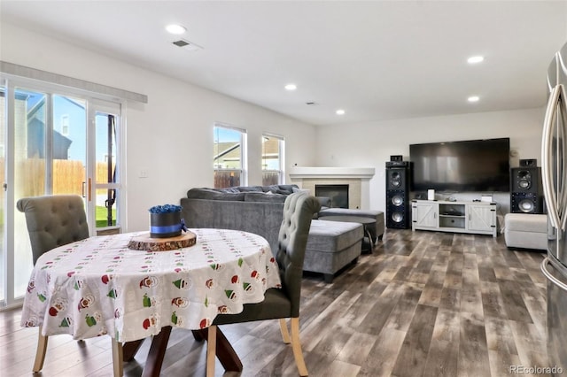 dining area with dark hardwood / wood-style flooring