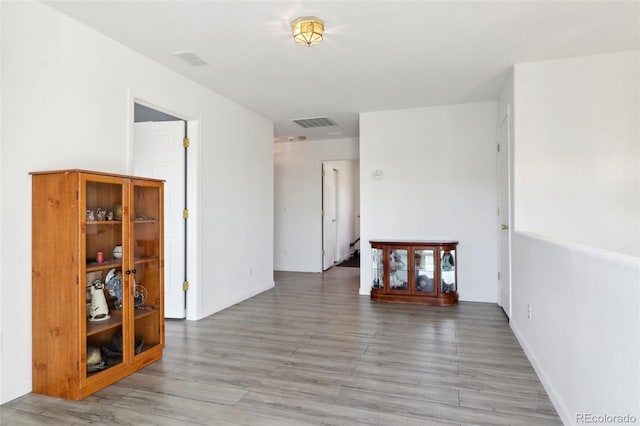 unfurnished room with light hardwood / wood-style flooring