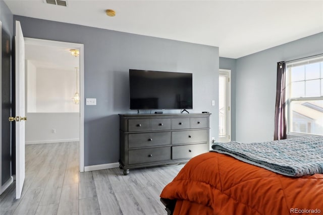 bedroom with light hardwood / wood-style floors