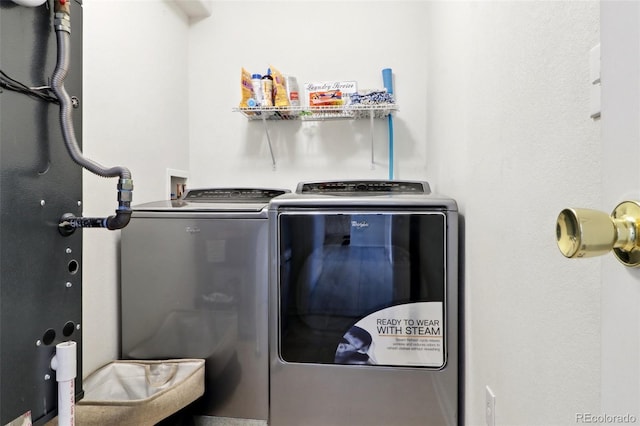 laundry room featuring washer and clothes dryer