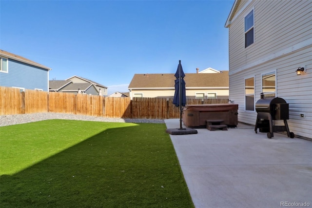 view of yard featuring a patio and a hot tub