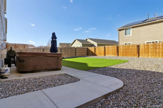 view of yard featuring a patio and a hot tub