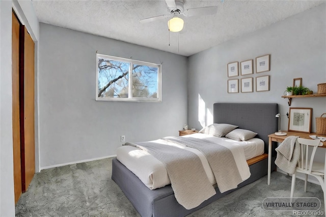 bedroom featuring carpet, a textured ceiling, ceiling fan, and a closet