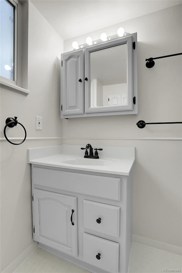 bathroom featuring vanity and baseboards