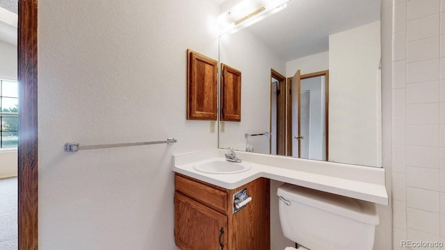 6796 S Independence St, Littleton, CO 80128 - bathroom with vanity and toilet