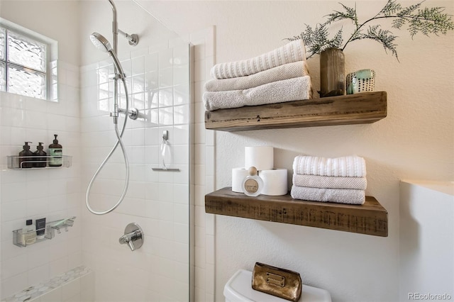 bathroom with a tile shower