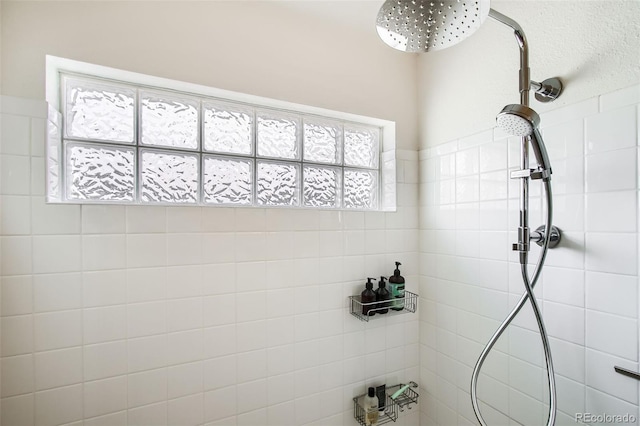 bathroom with tiled shower