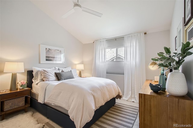 carpeted bedroom featuring ceiling fan and lofted ceiling