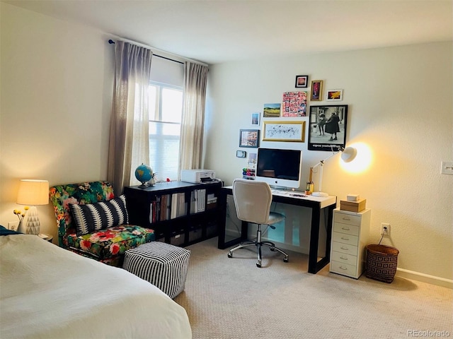 bedroom featuring light carpet