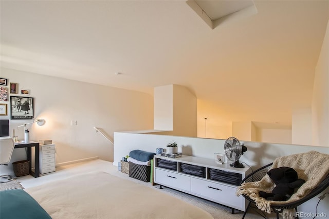 sitting room featuring light colored carpet