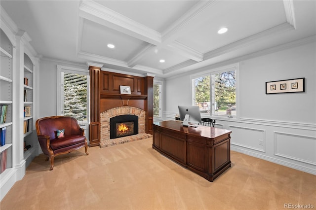 carpeted office space with built in shelves, coffered ceiling, crown molding, beamed ceiling, and a fireplace