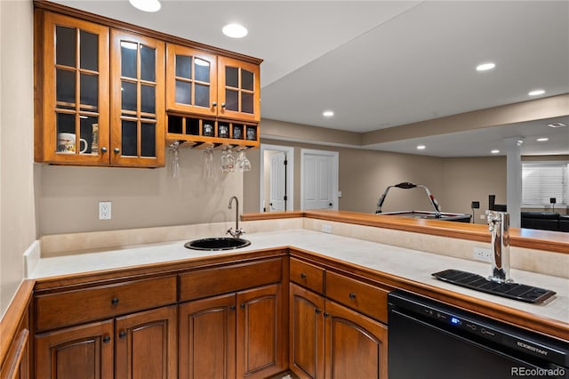 kitchen with sink, kitchen peninsula, and black dishwasher