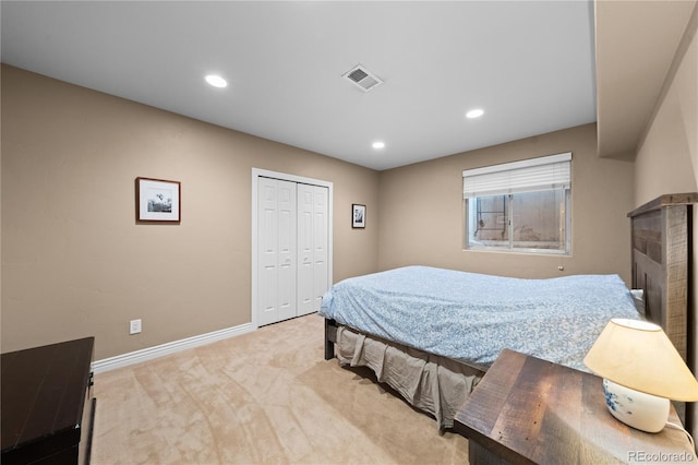 carpeted bedroom featuring a closet