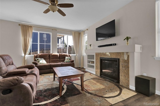 3266 Riverwood Way, Castle Rock, CO 80109 - living area featuring ceiling fan, baseboards, wood finished floors, and a fireplace