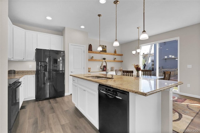3266 Riverwood Way, Castle Rock, CO 80109 - kitchen with a sink, black appliances, a center island with sink, and dark wood finished floors