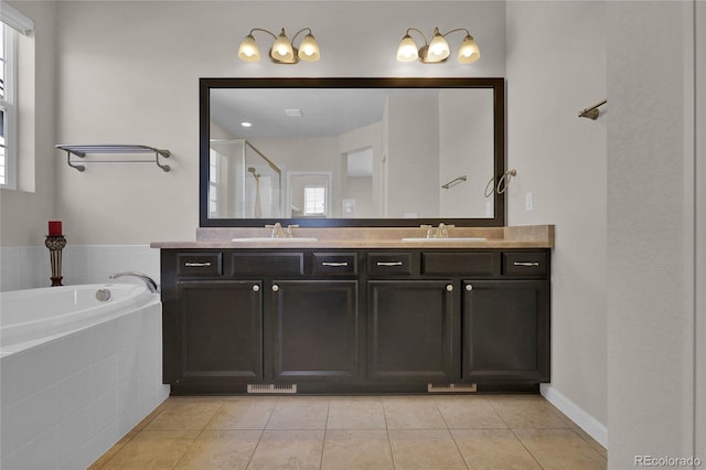 3266 Riverwood Way, Castle Rock, CO 80109 - bathroom featuring a garden tub, double vanity, a sink, and tile patterned flooring