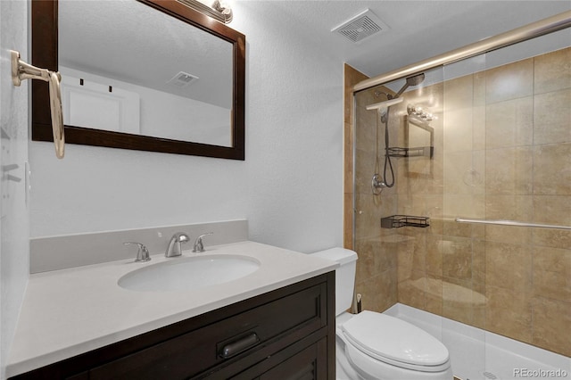 3266 Riverwood Way, Castle Rock, CO 80109 - bathroom featuring visible vents, toilet, a stall shower, and vanity