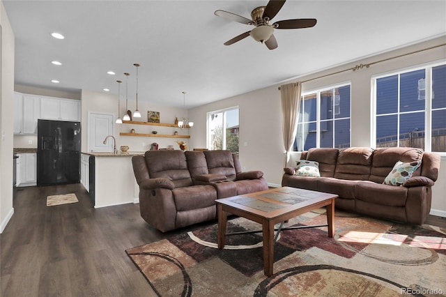 3266 Riverwood Way, Castle Rock, CO 80109 - living room featuring recessed lighting, ceiling fan with notable chandelier, baseboards, and dark wood finished floors