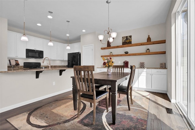 3266 Riverwood Way, Castle Rock, CO 80109 - dining area with recessed lighting, light wood-style flooring, and baseboards