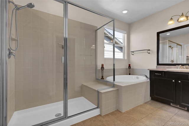 3266 Riverwood Way, Castle Rock, CO 80109 - bathroom featuring tile patterned floors, a shower stall, vanity, and a garden tub