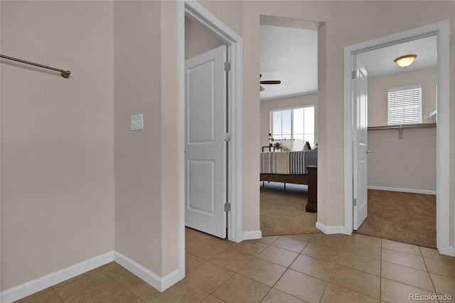 3266 Riverwood Way, Castle Rock, CO 80109 - hall featuring baseboards, light colored carpet, and light tile patterned flooring