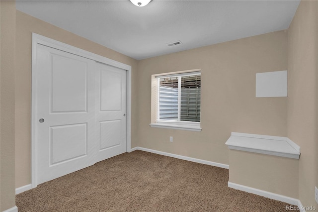 3266 Riverwood Way, Castle Rock, CO 80109 - unfurnished bedroom with a closet, carpet flooring, visible vents, and baseboards