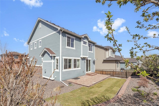 3266 Riverwood Way, Castle Rock, CO 80109 - rear view of property with a patio area, entry steps, a yard, board and batten siding, and fence