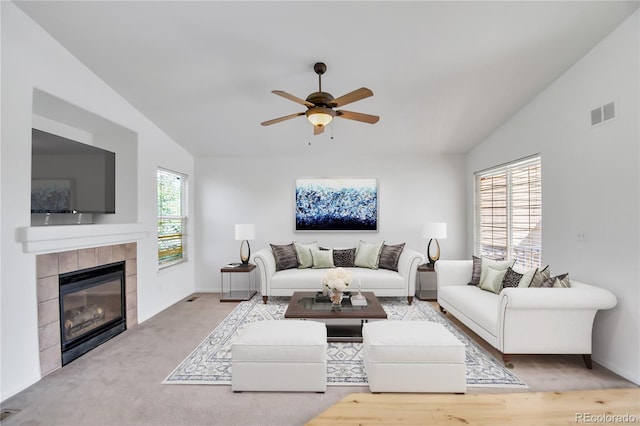 9905 Aftonwood St, Highlands Ranch, CO 80126 - living area with a ceiling fan, vaulted ceiling, and a tiled fireplace