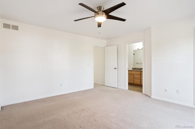 9905 Aftonwood St, Highlands Ranch, CO 80126 - unfurnished bedroom featuring light carpet, connected bathroom, and ceiling fan