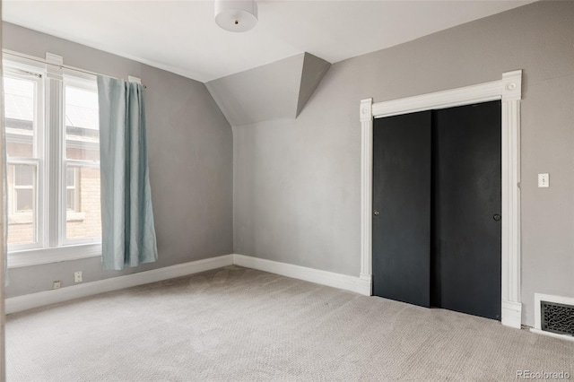 bonus room featuring carpet floors, baseboards, vaulted ceiling, and visible vents