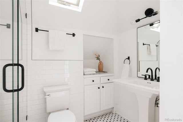 full bathroom with toilet and a shower stall