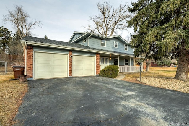 view of front of home with a porch and a garage