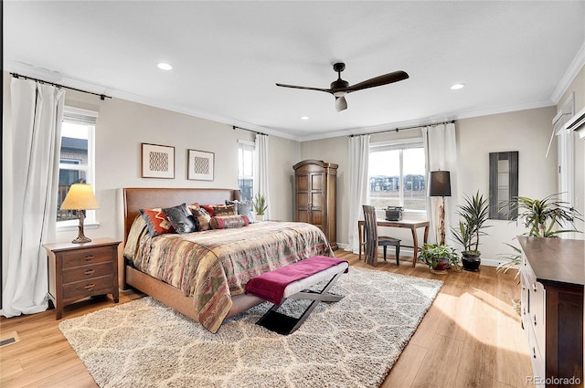 bedroom with recessed lighting, crown molding, and wood finished floors