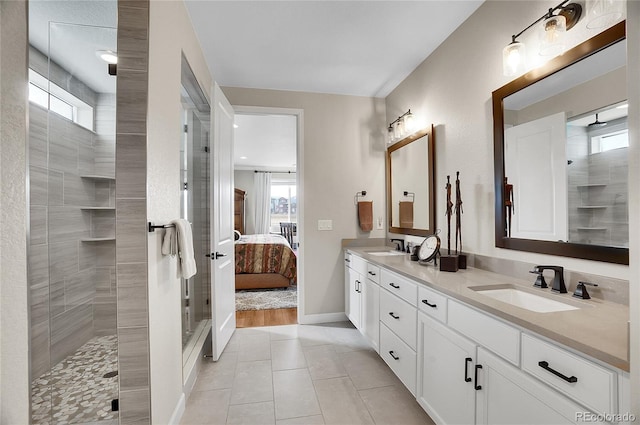 bathroom featuring a sink, ensuite bath, tile patterned flooring, double vanity, and tiled shower