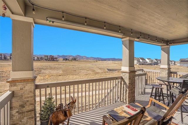 wooden terrace with a mountain view