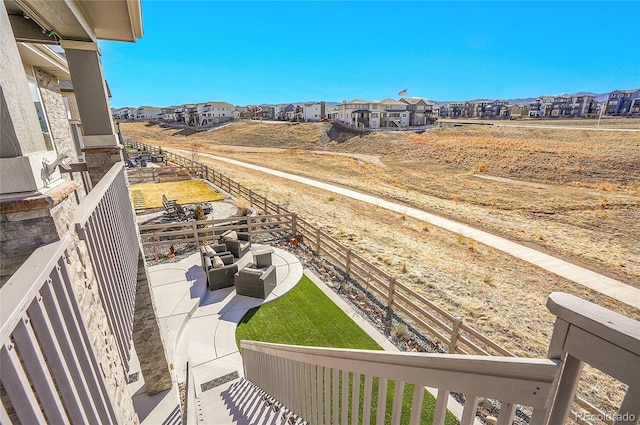 balcony featuring a patio area, a residential view, and an outdoor hangout area