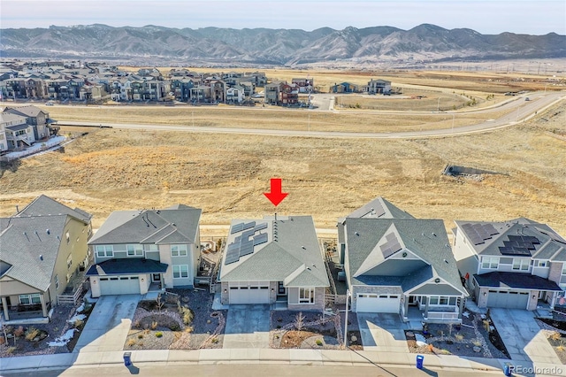 birds eye view of property featuring a mountain view and a residential view