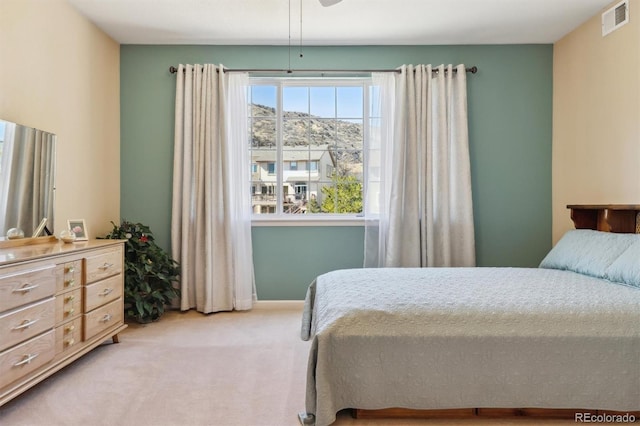 bedroom featuring carpet and visible vents