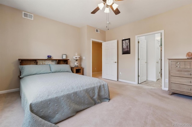 bedroom with light carpet, baseboards, and visible vents