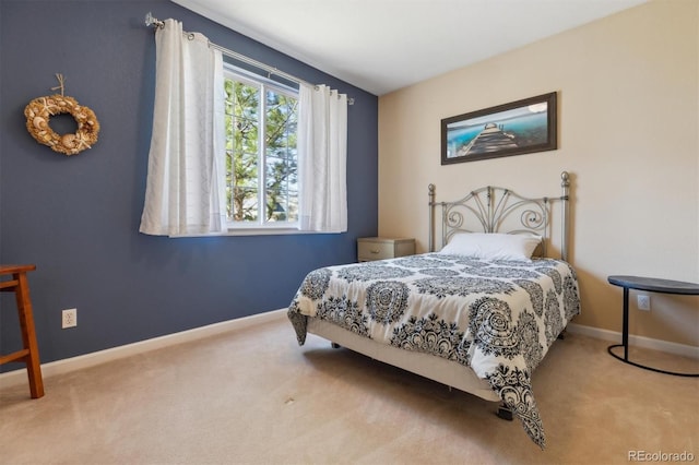 bedroom featuring carpet flooring and baseboards