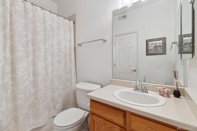 full bath with curtained shower, visible vents, vanity, and toilet