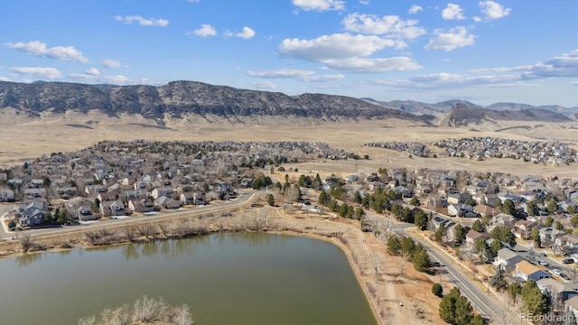 aerial view featuring a residential view and a water and mountain view