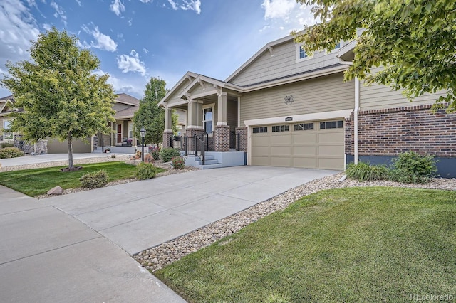 craftsman house featuring a garage, concrete driveway, a front lawn, and brick siding