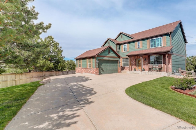 23427 Song Bird Hills Pl, Parker, CO 80138 - view of front of house featuring driveway, an attached garage, brick siding, and a porch